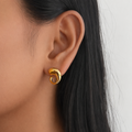 Solace Gold Curve, 18K PVD gold earrings by Febae